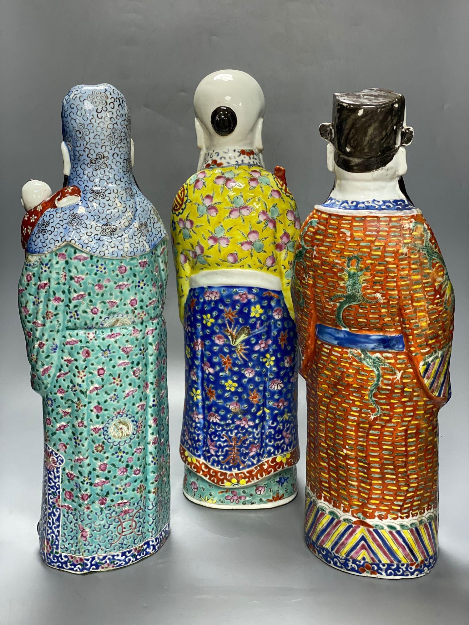 A group of three Chinese porcelain immortals, 47cm